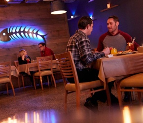 Two men dining at a restaurant.