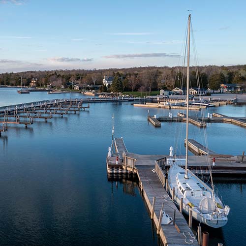 Aerial view of a sailboat docked in a marina