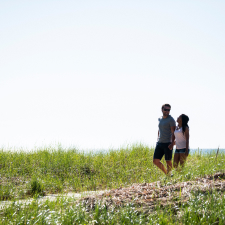 Couple walking on a trail.