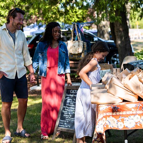 A family at an outdoor market