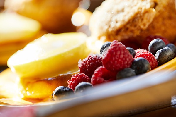 A beautiful plate of breakfast foods and berries.