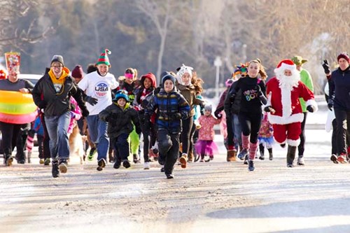 Runners in costumes participate in the Fruit Loop Run.