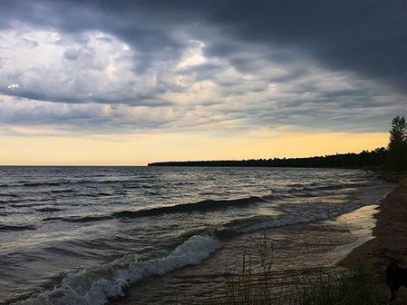 Stormy sunset sky over the lake