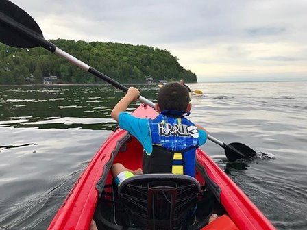 A kayaker out on the lake.