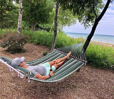 A man relaxing in a hammock