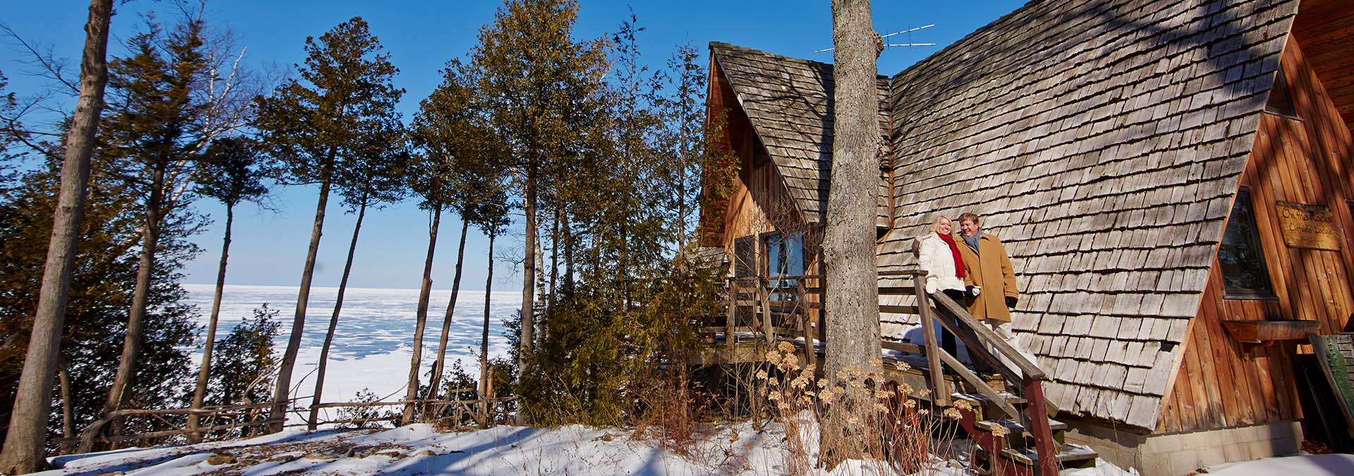 A couple walking out of their cabin