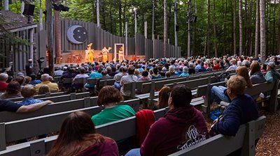 A group of travelers enjoying a show after a destination meeting in Door County.