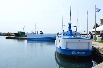 Boats docked at the shore.