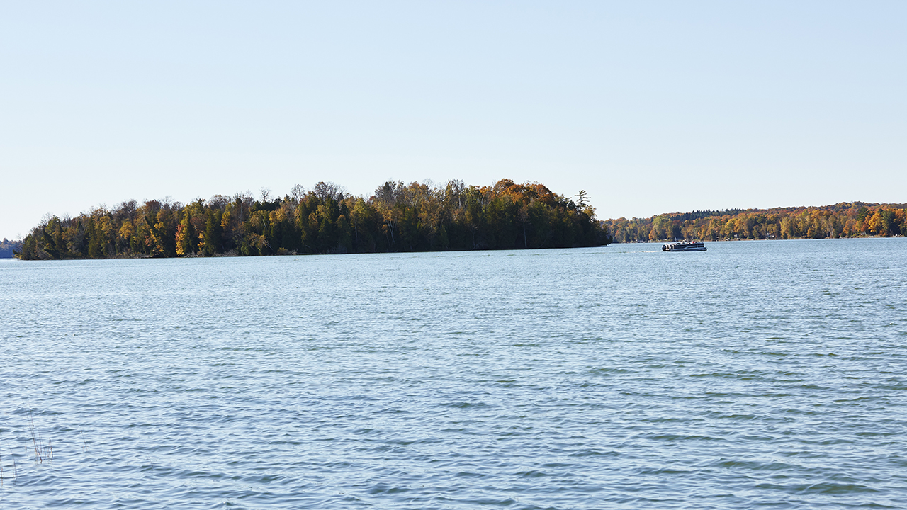 A scenic view of an inland lake and island.