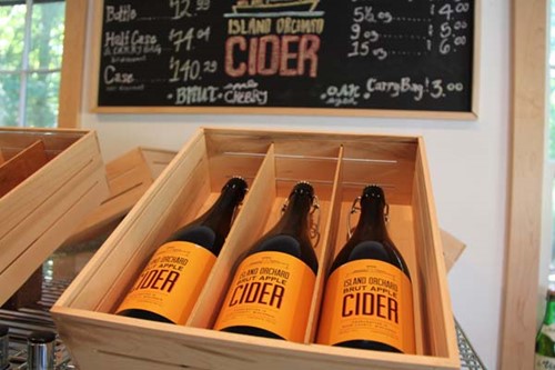 Several bottles of Island Orchard Cider at the cidery store.