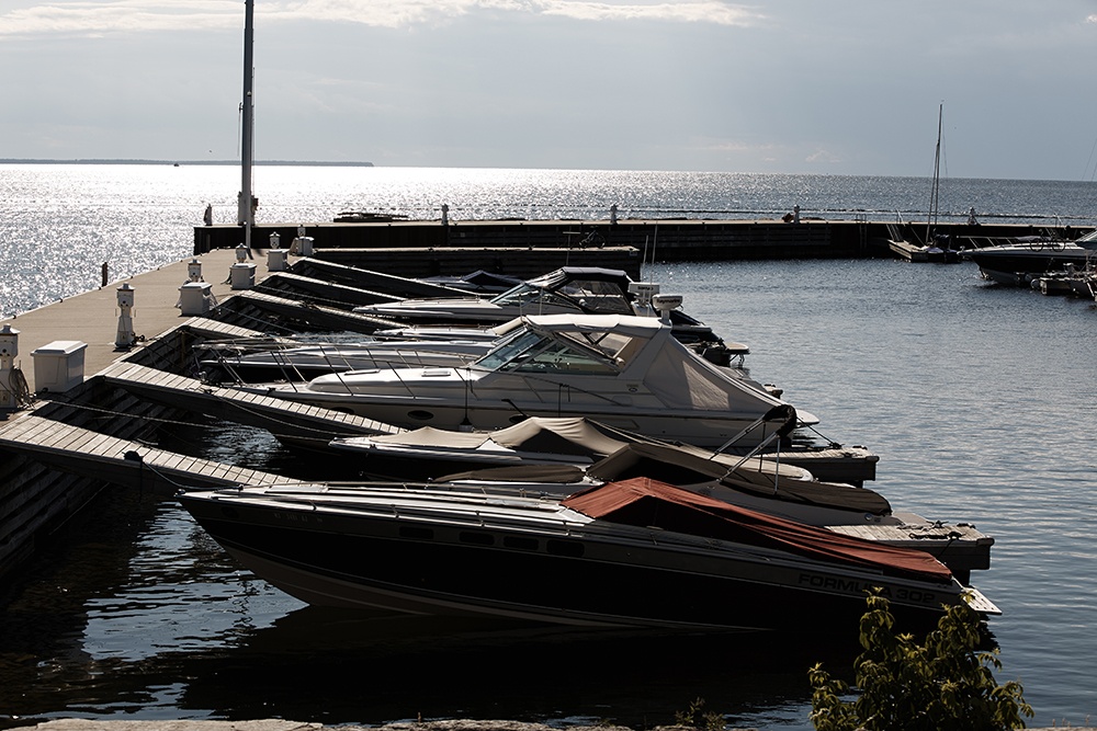 Boats at a marina at sunset.