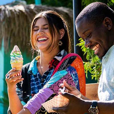 People eating ice creaming and laughing together