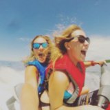 Two women taking a selfie while out on a jet ski