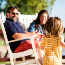 A family enjoying being on a porch