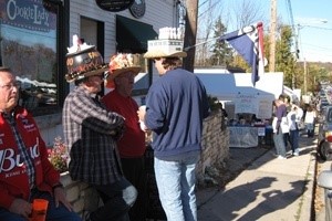 People standing outside a shop talking.