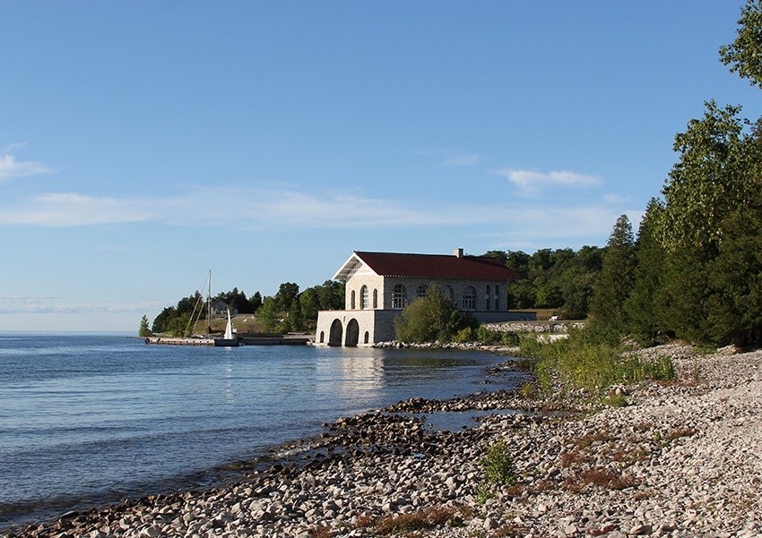 A stone boathouse in the distance at Rock Island.