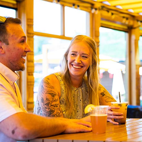 A couple having drinks at the bar