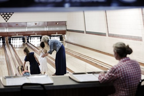 A family bowls at Sister Bay Bowl.