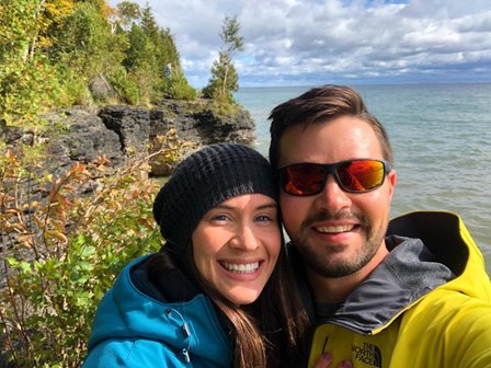 A couple taking a selfie overlooking the lake