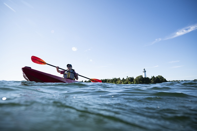 Kayaker paddling through the water