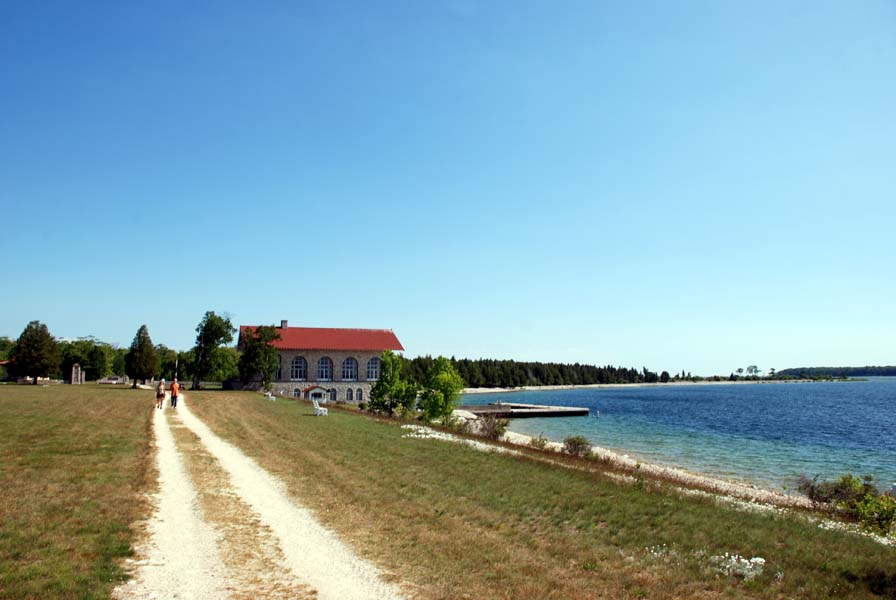 View of a vintage boathouse on a lakeside trail on Rock Island.