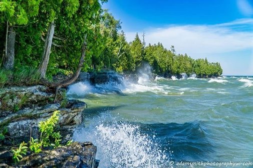 Waves crashing on the shore of the lake.