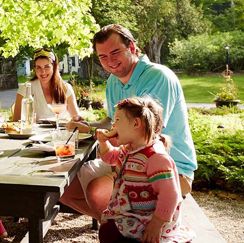 A family eating together at a picnic table