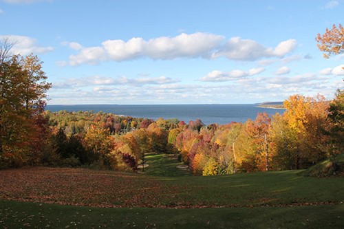 A golf course bathed in fall color.