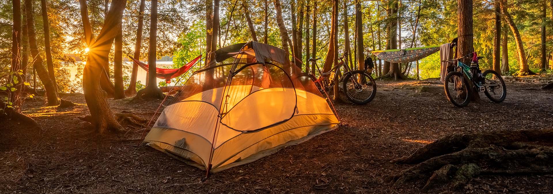 A campsite and tent at sunrise