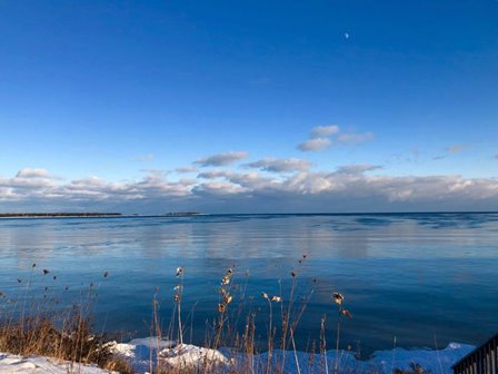 Clouds low in the sky over the lake horizon