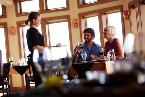 A couple dines in an elegant restaurant in Sister Bay.