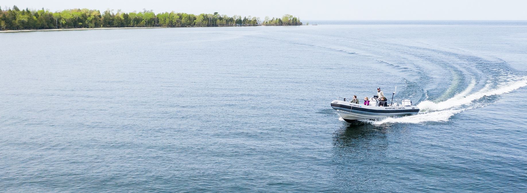 A family boating out on the lake.